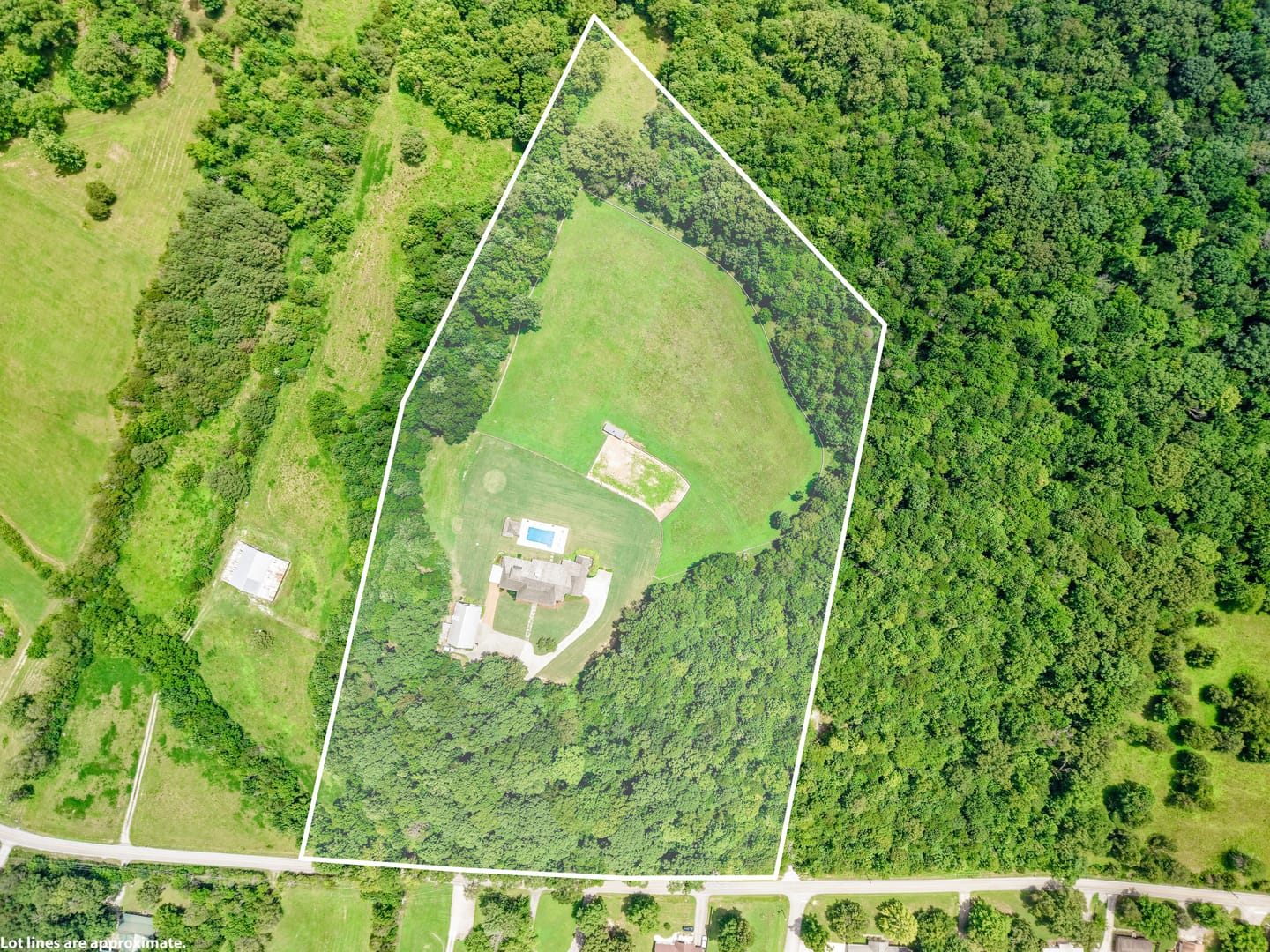 Closer aerial view with the approximate property boundary outlined
