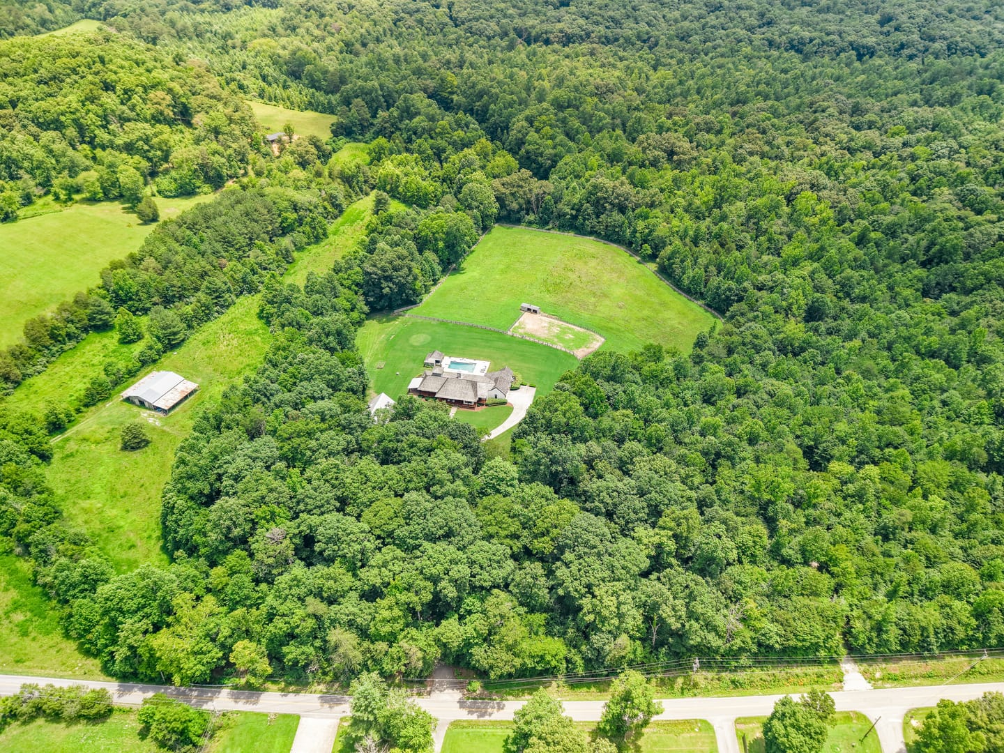 Overhead aerial view of the property and the surrounding woodland