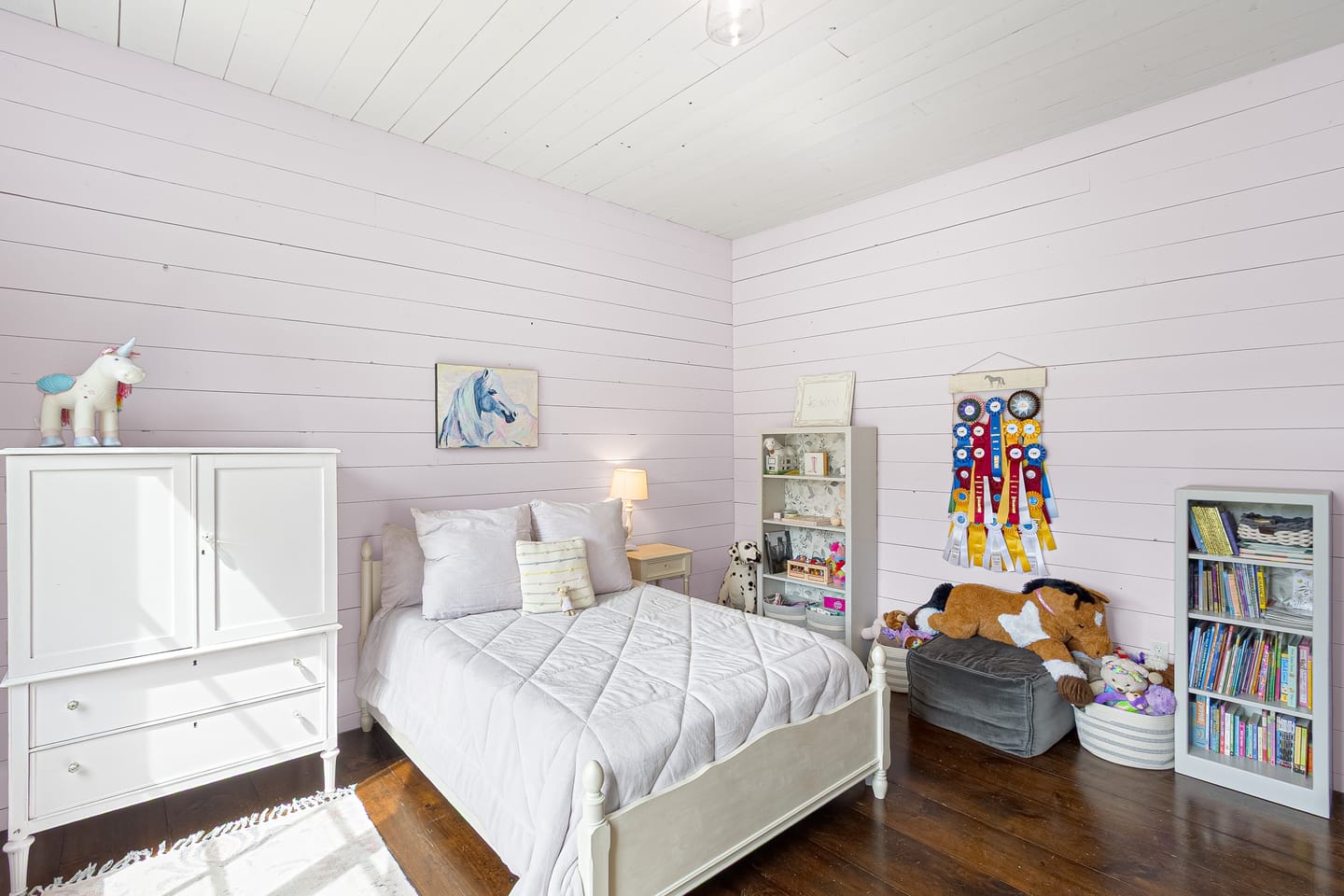 Bedroom with white shiplap walls, second view