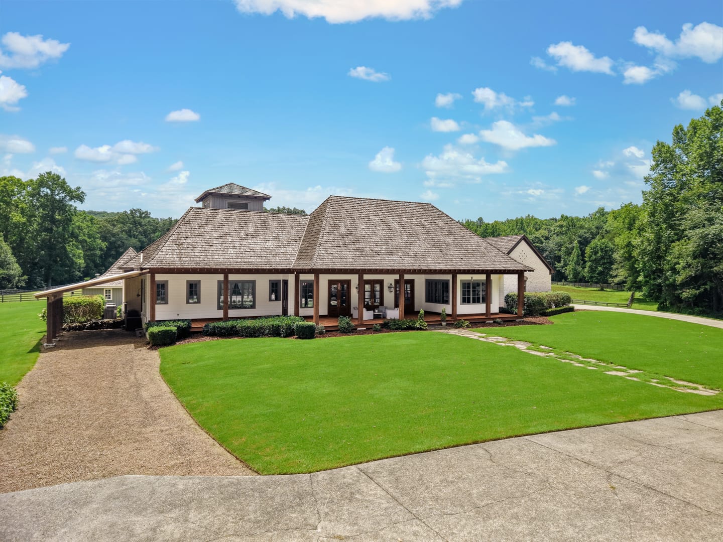 Main residence seen from the curving drive across the front lawn