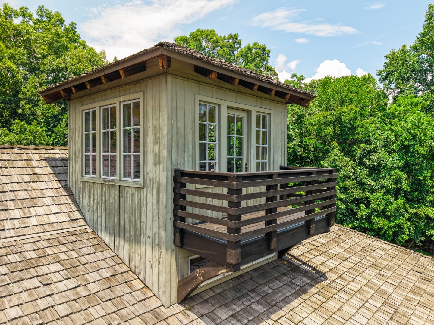 Rooftop lookout with windows on every side and a balcony
