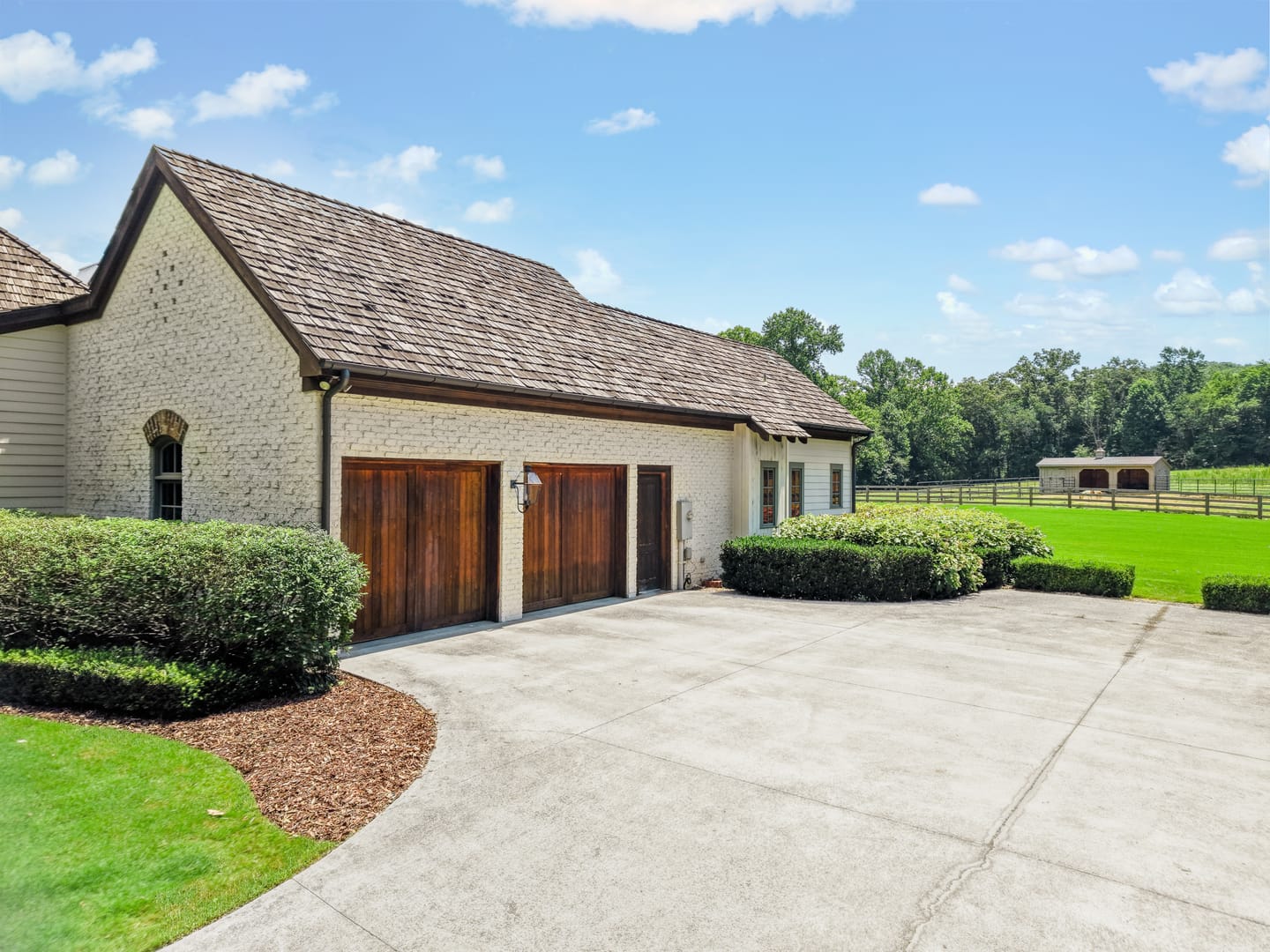 Side-entry garage with wood carriage doors